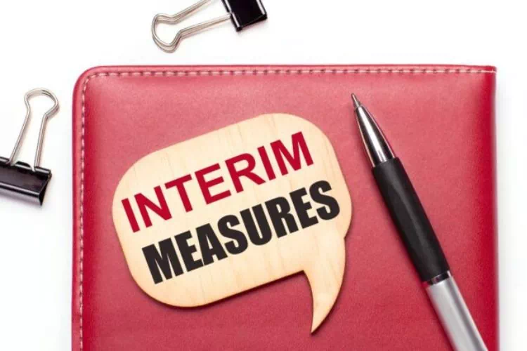 Cahier portant sur sa couverture l'inscription Mesures temporaires