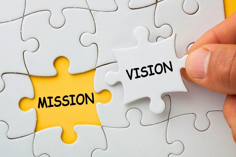 Puzzle sur lequel il est écrit vision et mission représentant les missions d'un chef de projet